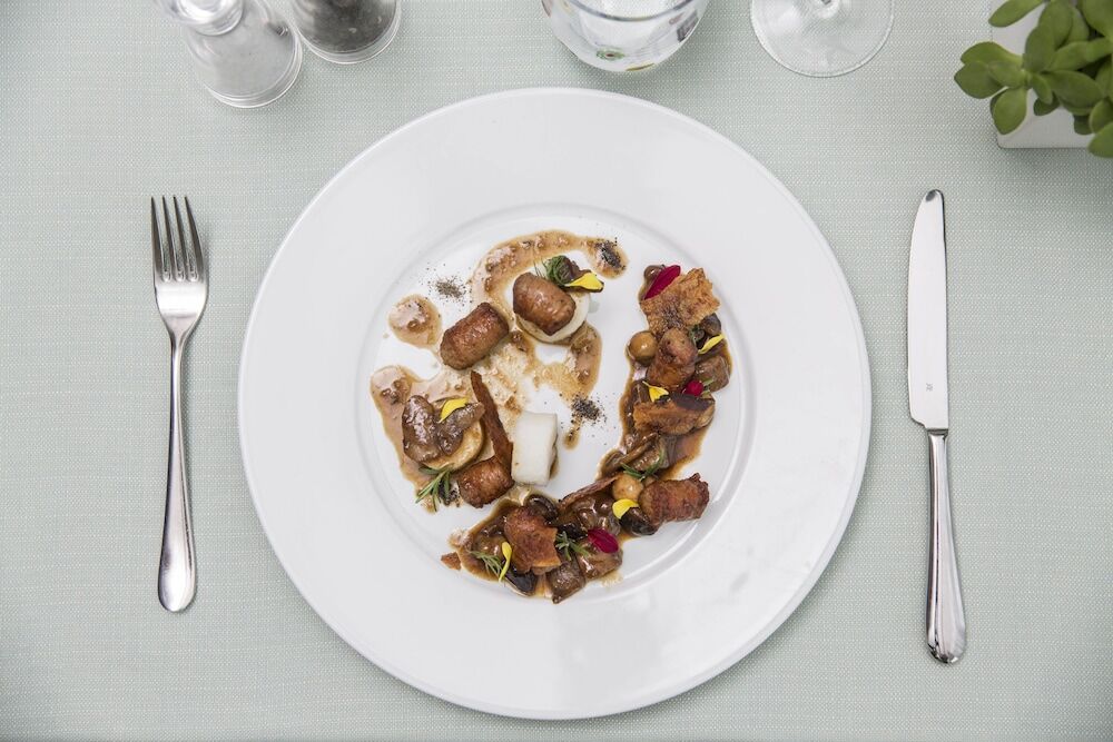 فندق وسبا فالكينستاينير جيسولو ليدو دي يسولو المظهر الخارجي الصورة A plate of food